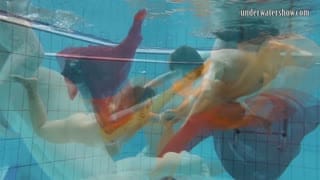 Two hotties submerged underwater